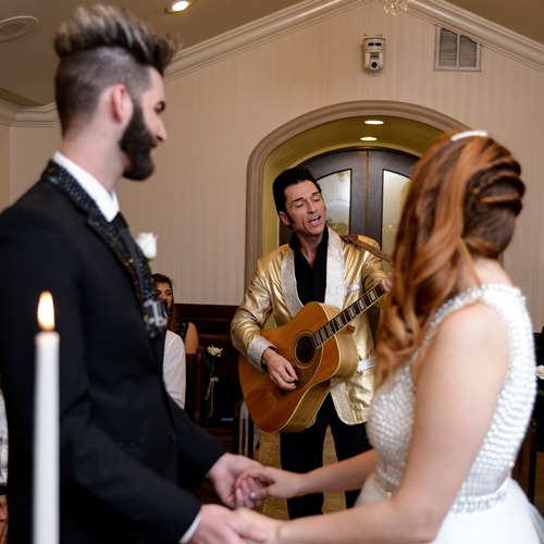 Elvis Serenades Couple at Chapel of the Flowers Wedding in Las Vegas
